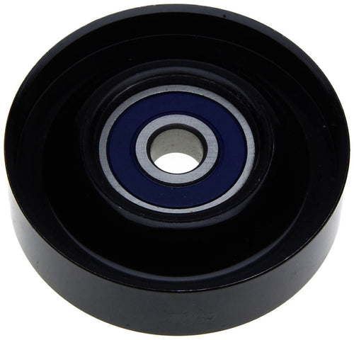 Close-up of a black metal idler pulley with visible blue-sealed bearing and central mounting hole