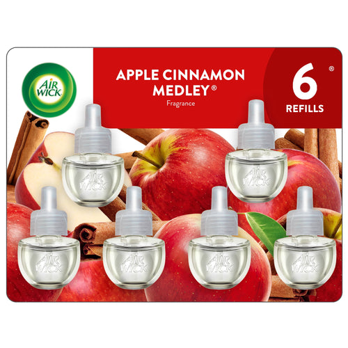 Air Wick Apple Cinnamon Medley refill blister pack showing six clear plug-in oil refills over apples and cinnamon sticks