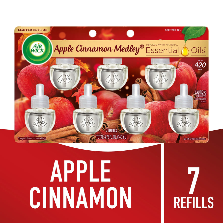 Air Wick Apple Cinnamon Medley refill blister pack showing seven clear scented oil refill pods over apple and cinnamon background