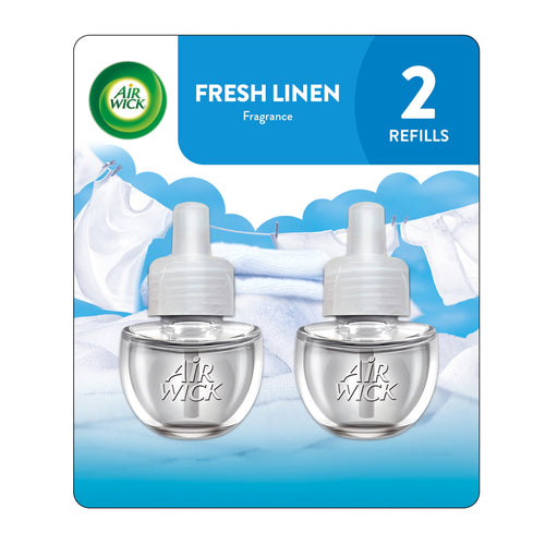 Two clear Air Wick plug-in scented oil refill bottles displayed on Fresh Linen branded blister card with laundry imagery