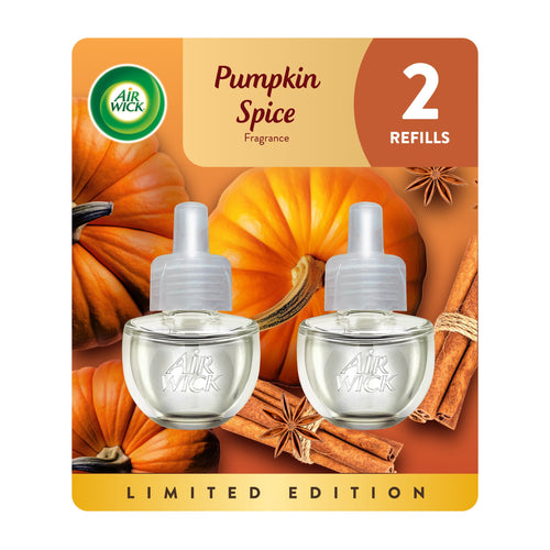 Air Wick pumpkin spice plug-in refill retail blister pack showing two clear oil refill bottles and pumpkin background.