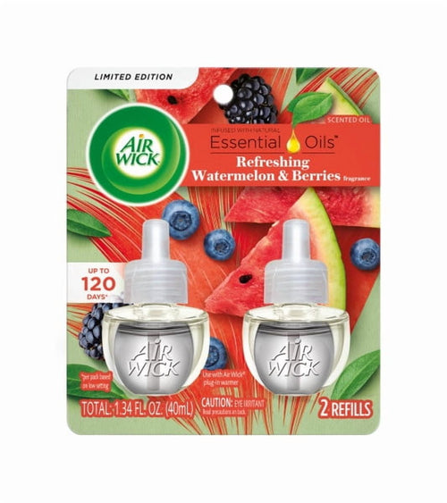 Air Wick branded blister pack showing two plug-in scented oil refill bottles with watermelon and berries artwork