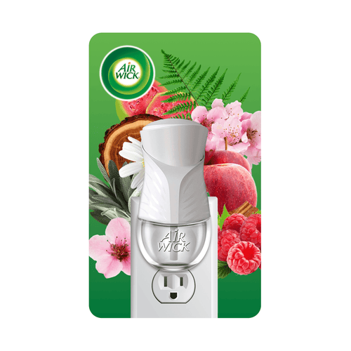 White Air Wick plug-in oil warmer shown inserted in outlet with floral and fruit background art