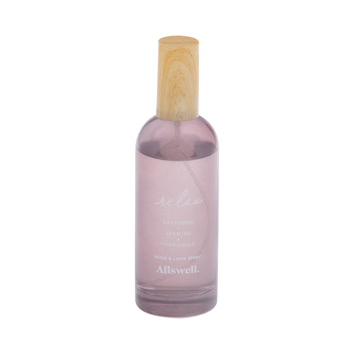 Tall translucent mauve Allswell 'Relax' room and linen spray bottle with wooden cap on white background.