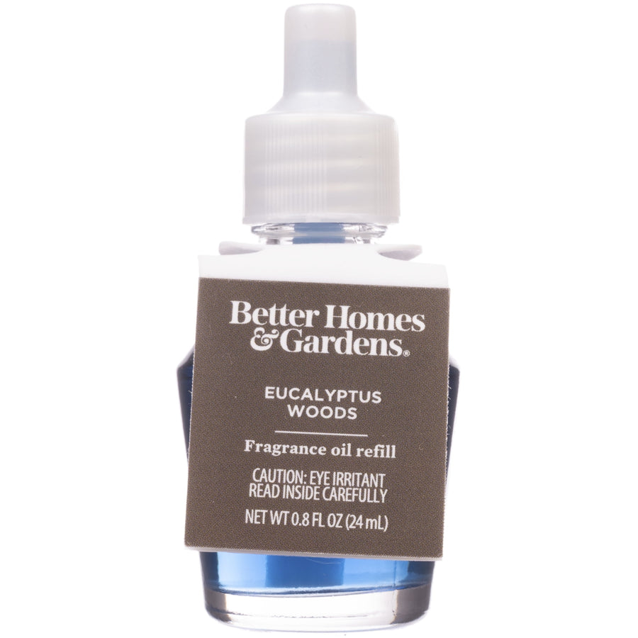 Close-up of Better Homes & Gardens eucalyptus woods fragrance oil refill bottle with brown label and blue liquid