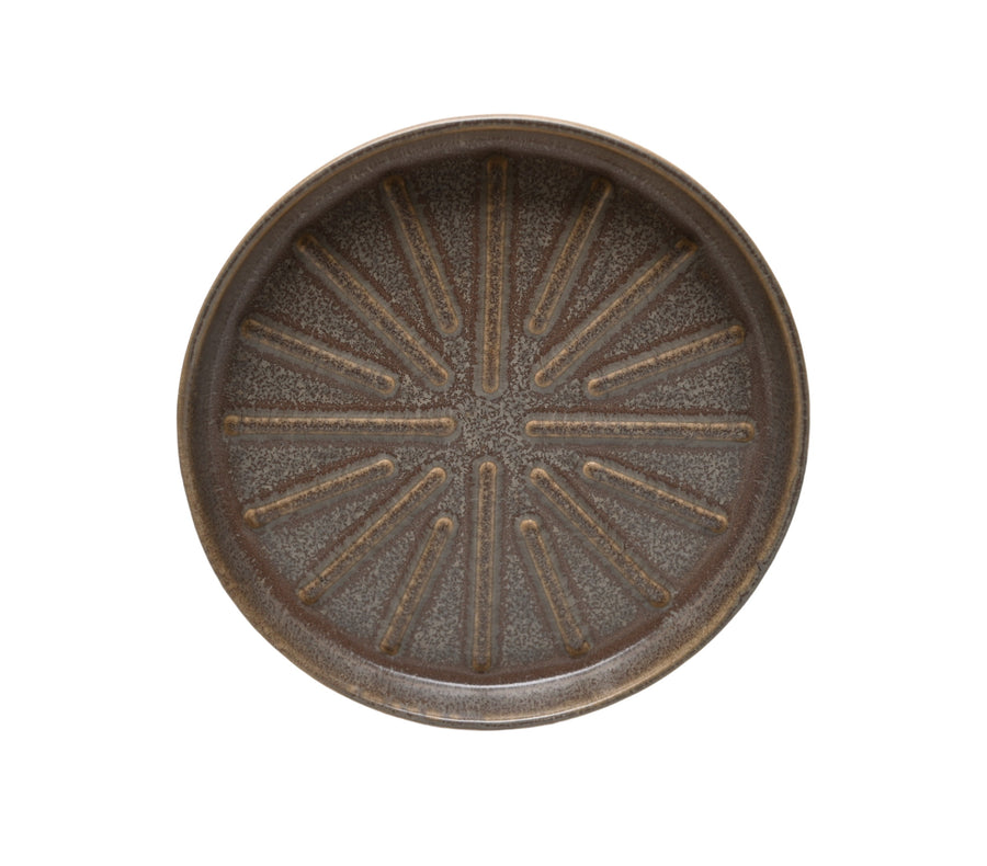 Top-down view of a round Better Homes & Gardens ceramic planter saucer with textured radial pattern and gray-brown glaze.