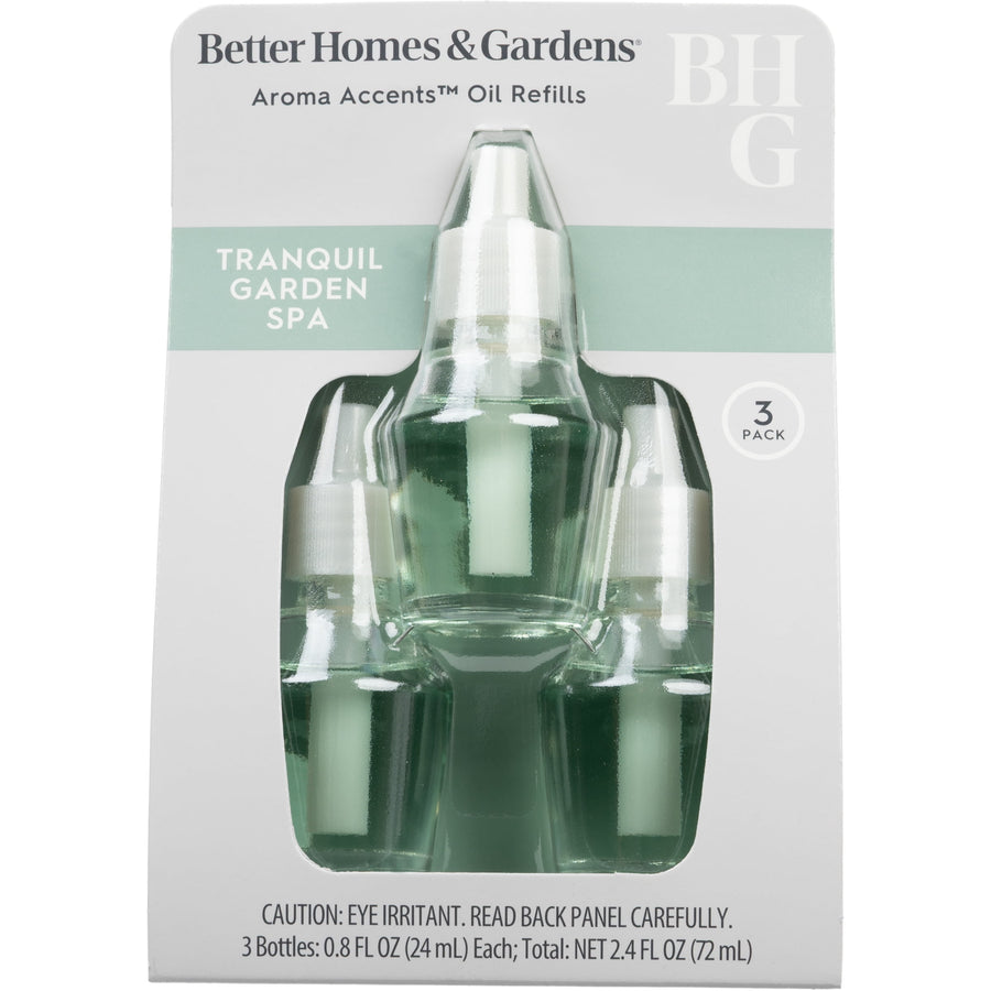 Retail blister pack front showing three Better Homes & Gardens Aroma Accents refill bottles labeled ‘Tranquil Garden Spa’.