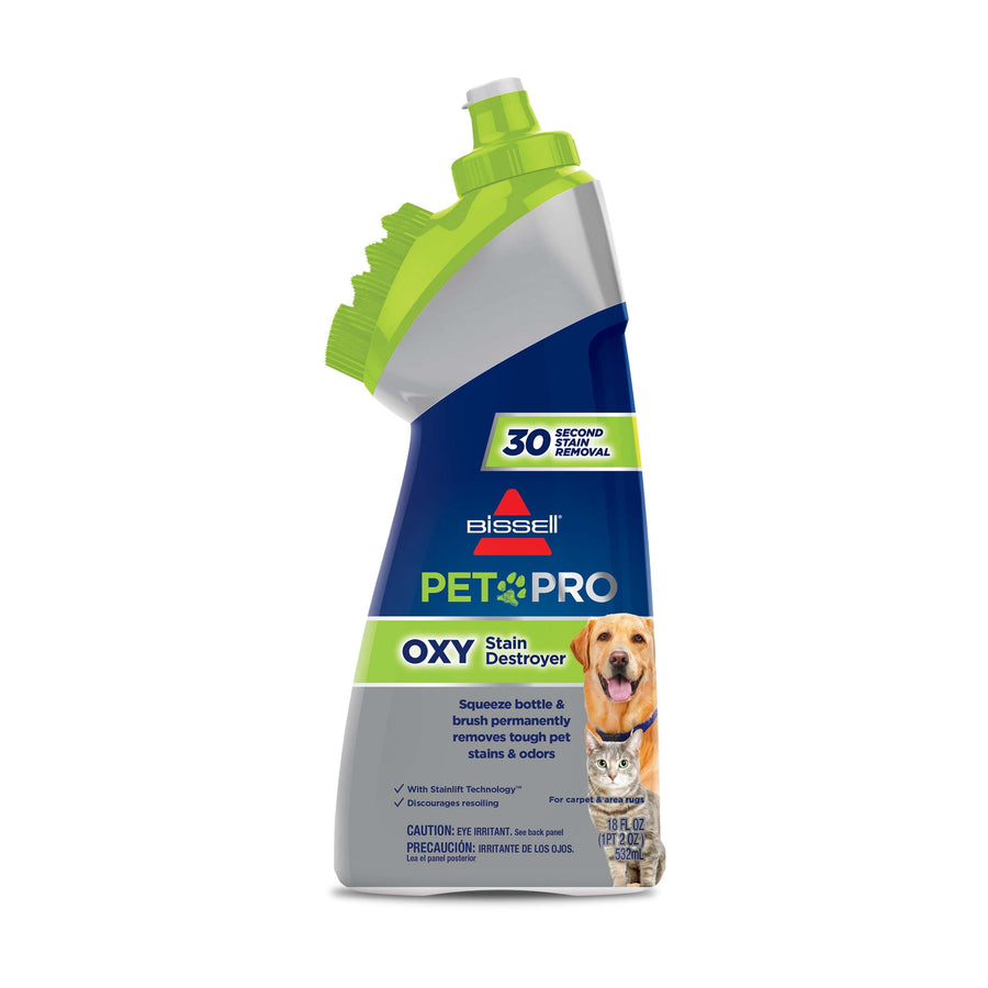 Front-facing BISSELL PET PRO OXY stain destroyer bottle with green brush cap and pet photo on label.