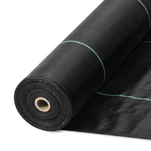 Close-up of a rolled black woven landscape fabric roll with a cardboard core and blue alignment lines