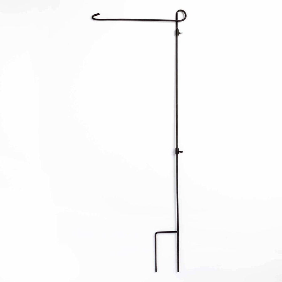 Black wrought-iron garden flag stand with curved top hook and two-prong ground stake on a white background.