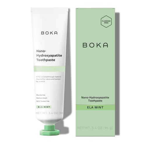 BOKA Ela Mint nano-hydroxyapatite toothpaste tube next to matching light green product box on white background.