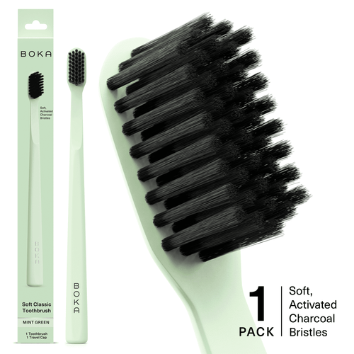 Mint green Boka toothbrush with black activated charcoal bristles shown alongside packaging and a close-up of the brush head.