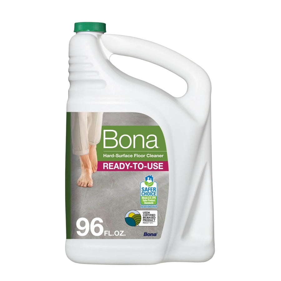 White Bona hard-surface floor cleaner jug with green cap and label showing bare feet on tile, 96 fl oz marking
