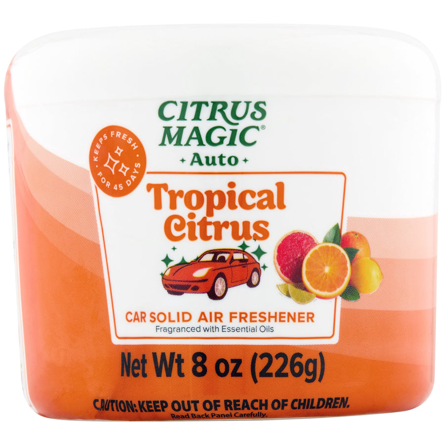 Front-facing Citrus Magic Auto Tropical Citrus car solid air freshener container with orange label and citrus illustration.