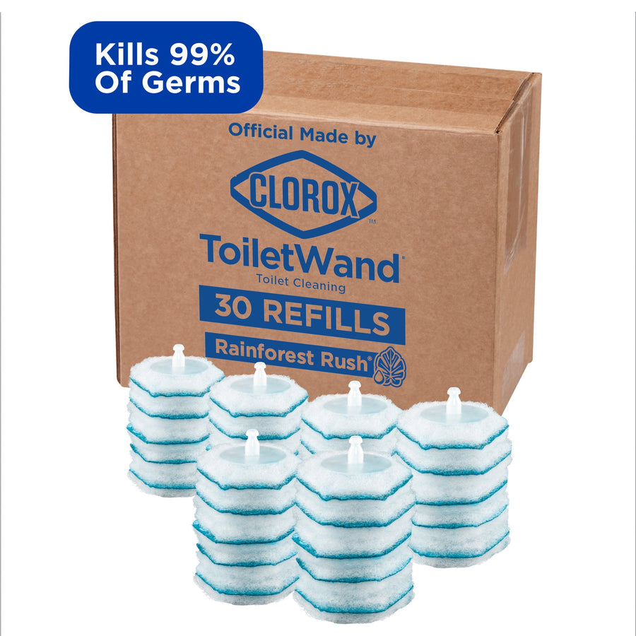 Cardboard box labeled Clorox ToiletWand with several stacked blue-and-white round scrubbing refill pads arranged in front