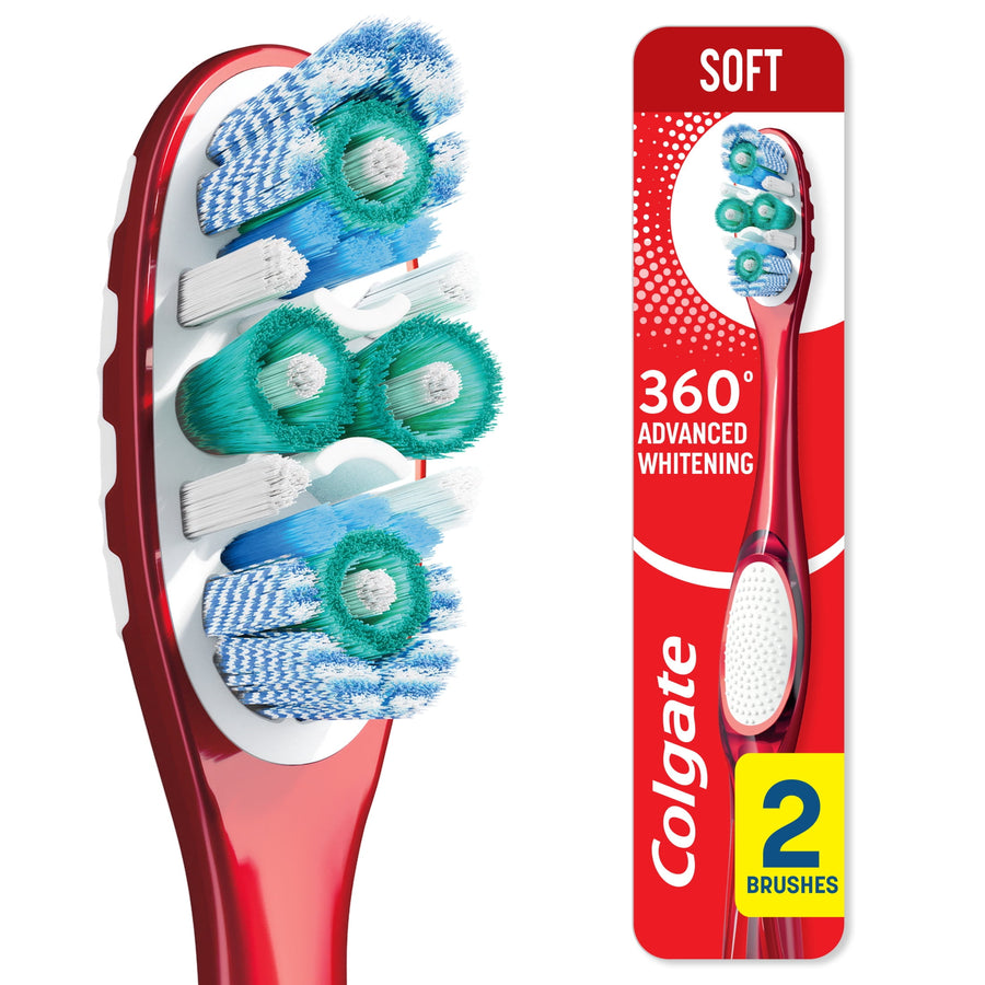 Close-up of a red Colgate 360° toothbrush head showing polishing cups and varied bristle clusters on white background