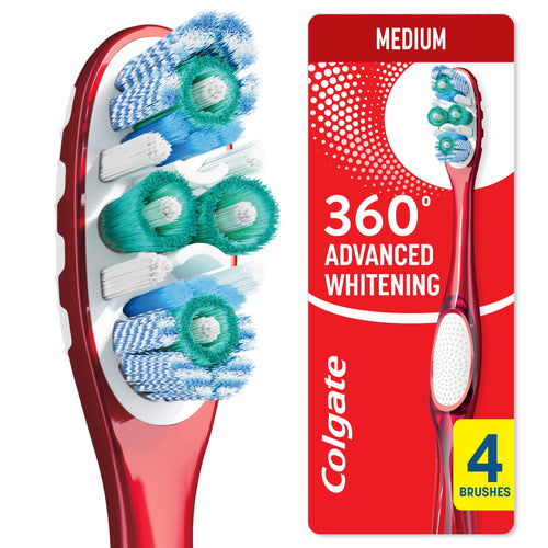 Close-up of a red Colgate 360 toothbrush head showing polishing cups and multi-directional bristles on red background.