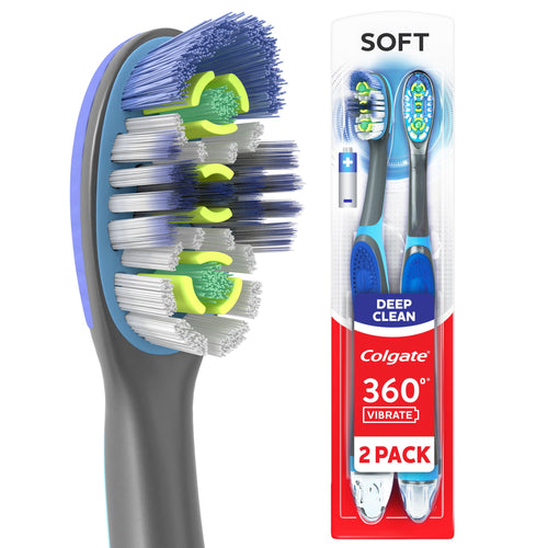 Close-up of Colgate 360 Vibrate toothbrush head showing multi-level soft bristles and blue-gray handle with packaging beside it