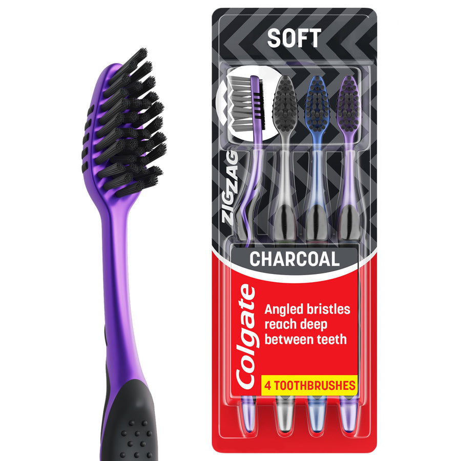 Packaged Colgate ZigZag toothbrush blister pack showing four soft charcoal-bristled toothbrushes in purple and blue handles