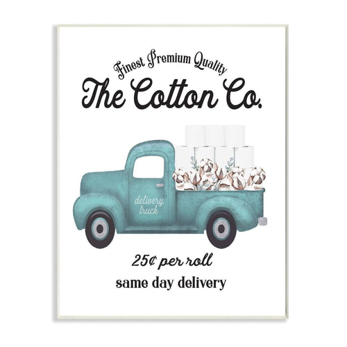 Framed white wall plaque with teal delivery truck illustration carrying toilet paper and cotton, vintage typography header.