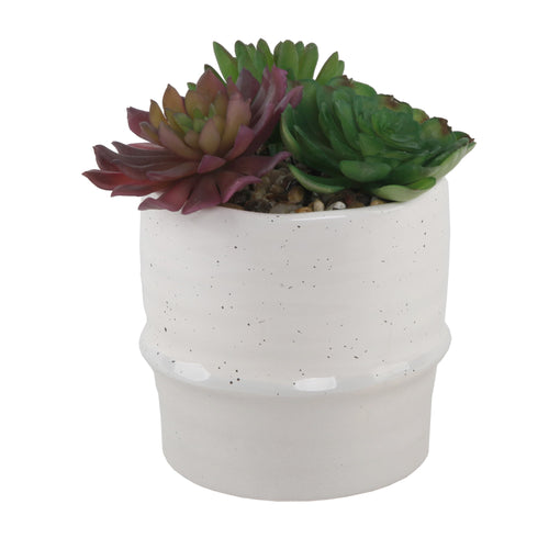 Cream speckled ceramic planter with two faux succulents and pebbles, clean white background