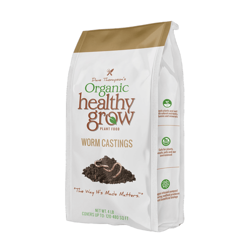 White and tan bag of Dave Thompson’s Organic Healthy Grow worm castings with a pile of dark castings and worms on the front