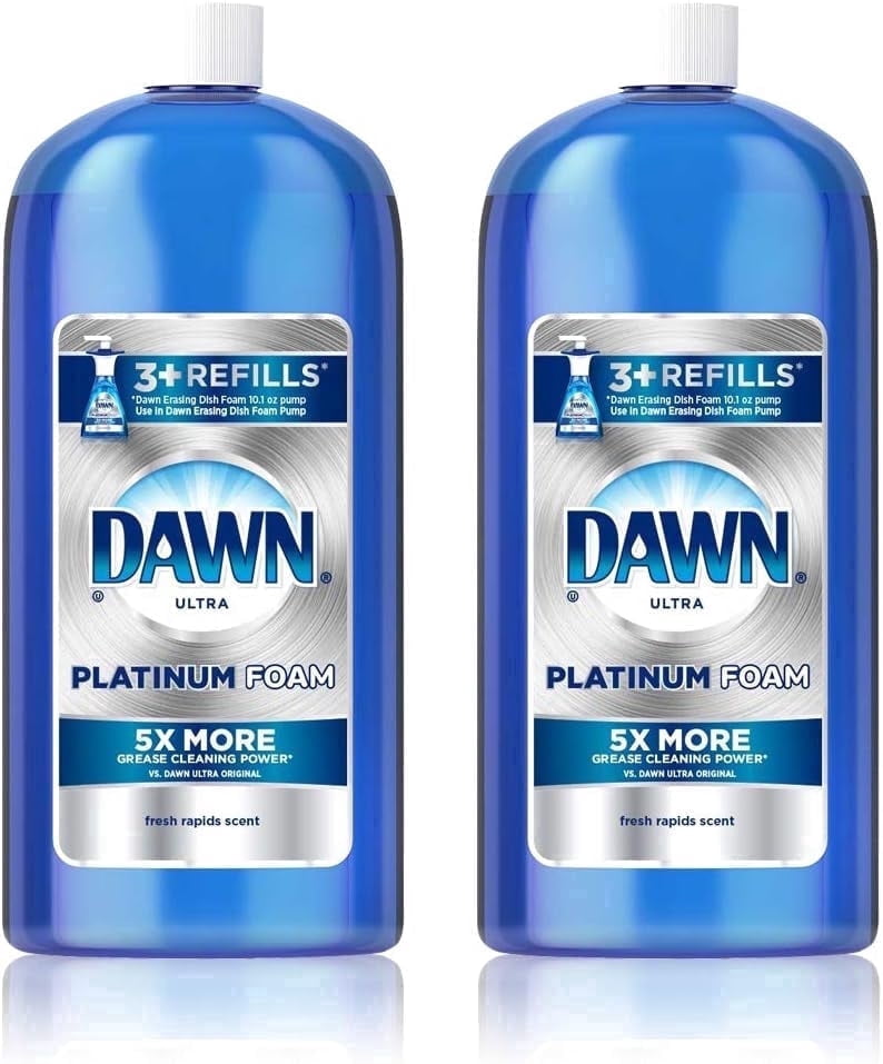 Two tall blue Dawn Ultra Platinum Foam refill bottles labeled "Platinum Foam" with 3+ refills badge and fresh rapids scent