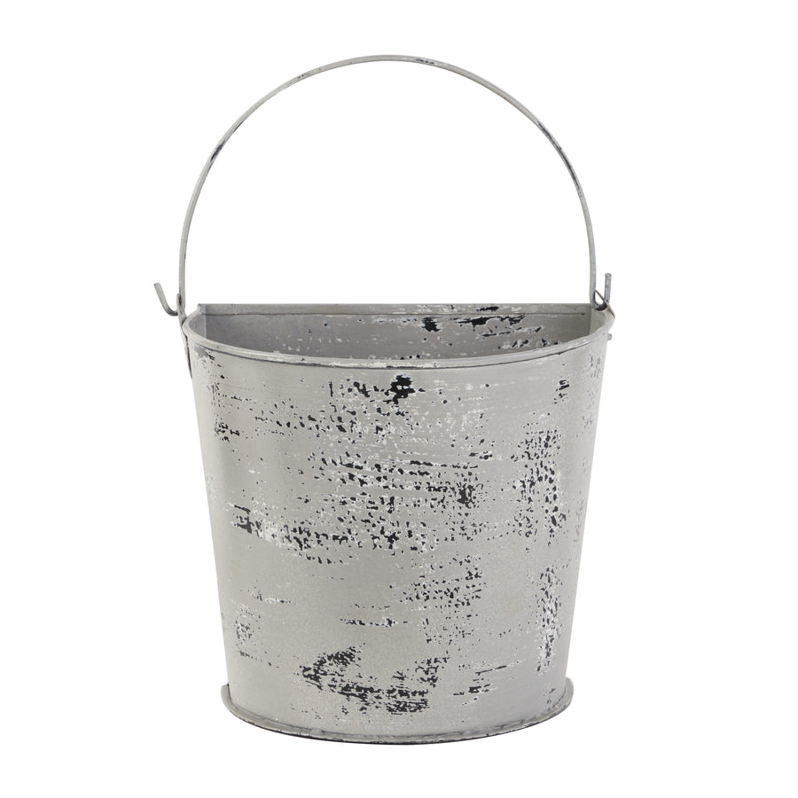 Distressed white-gray metal bucket planter with a curved handle on a white background