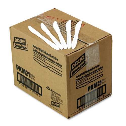 Cardboard shipping box labeled Dixie Dense Pack with several white disposable knives displayed on top