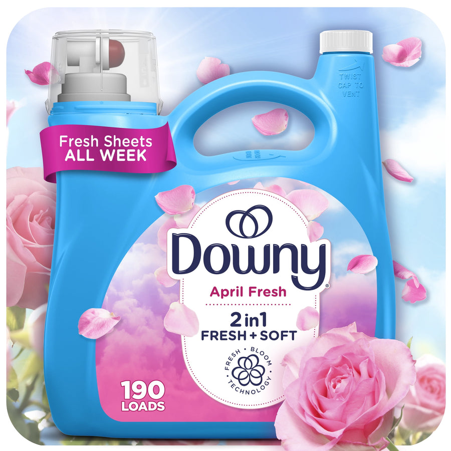 Blue Downy bottle labeled April Fresh 2in1 with pink roses and petals surrounding the packaging