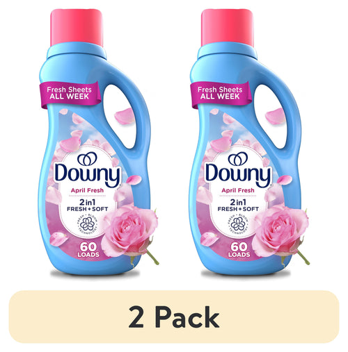 Two blue Downy April Fresh liquid fabric softener bottles side-by-side with rose petals and a rose, labeled 60 loads.