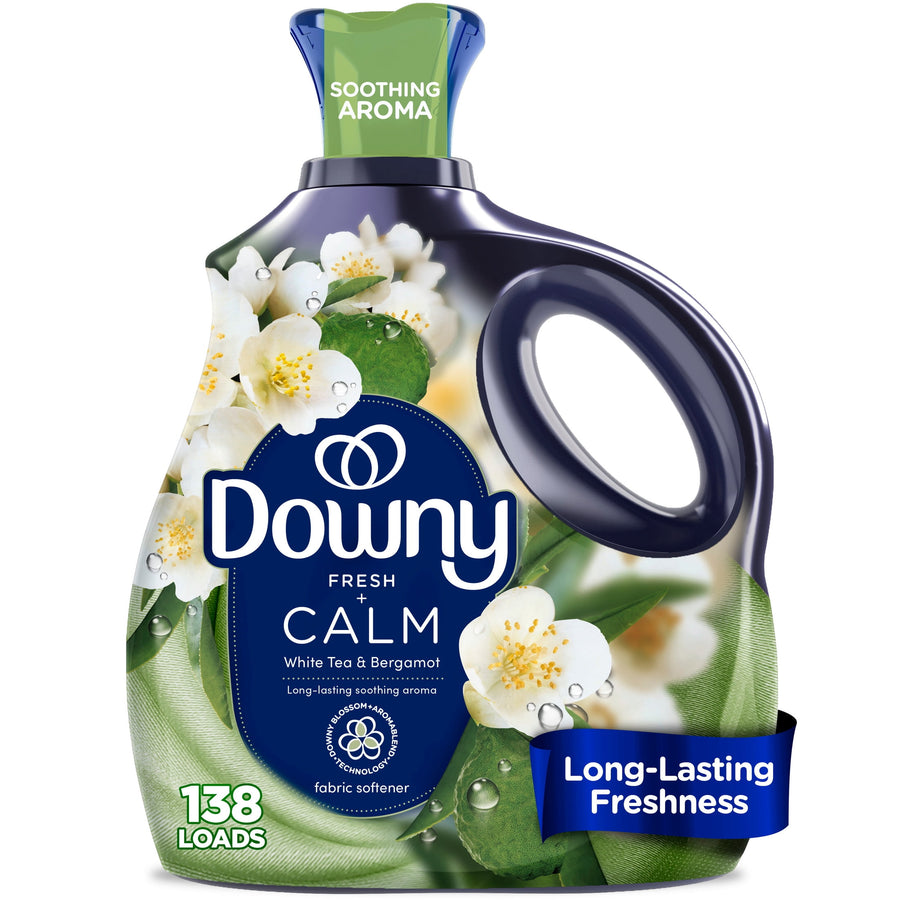 Close-up of a Downy Fresh Calm liquid fabric softener bottle with white floral graphics and green accents.