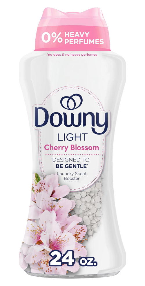 Close-up of a Downy Light Cherry Blossom scent booster bottle showing label, blossoms and white beads.