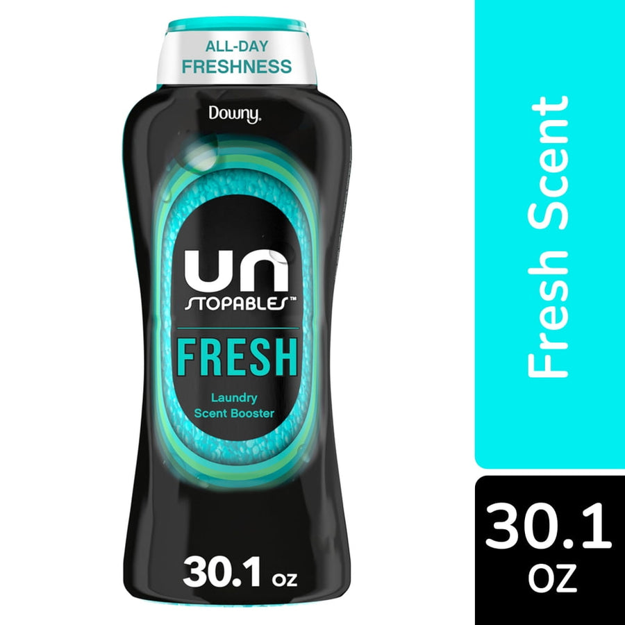 Close-up of a Downy Unstopables Fresh in-wash scent booster bottle showing black packaging and teal accents with 30.1 oz label