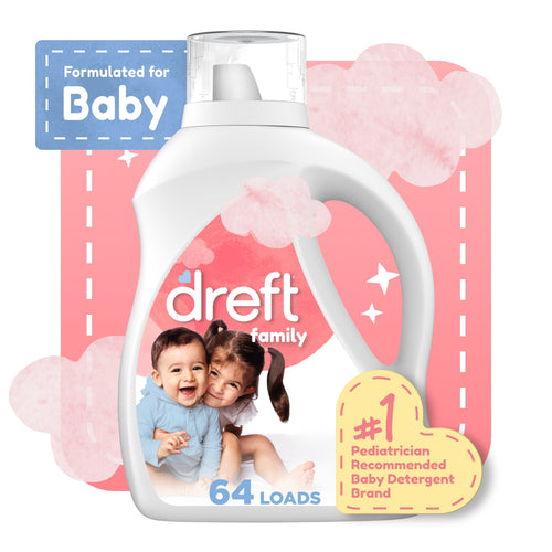 White Dreft Family liquid detergent bottle with smiling toddler and child on label against pink cloud background