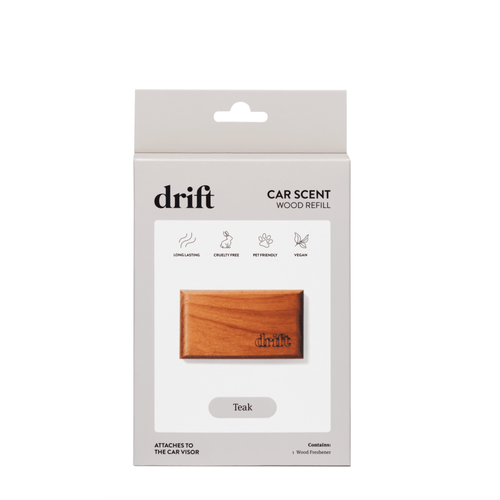 Packaged Drift wood car scent refill in teak finish shown on white backing with brand name and icons