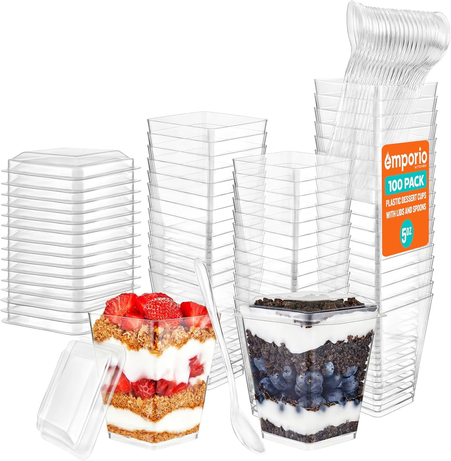 Stacks of clear hexagonal plastic dessert cups with lids and spoons, two filled parfaits foreground