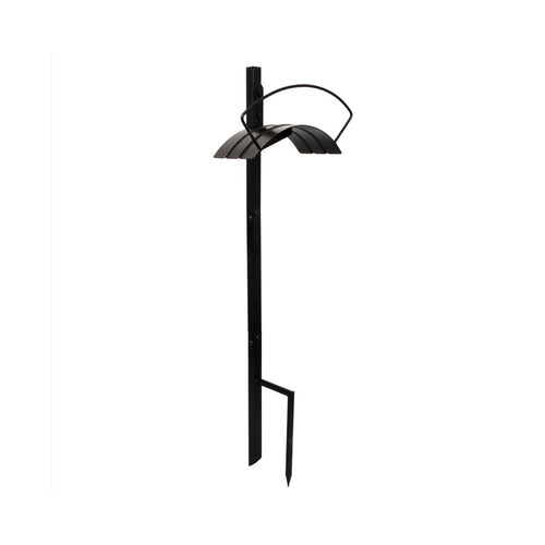 Black metal garden hose holder post with curved top cradle and ground stake on white background