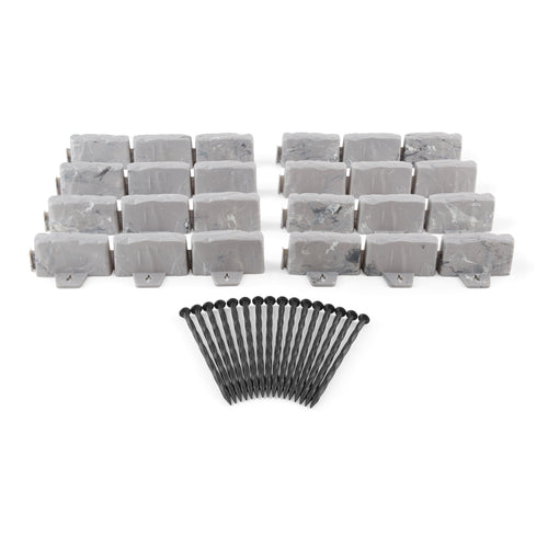 Rows of gray faux-stone plastic edging pieces arranged with a fan of black landscape stakes