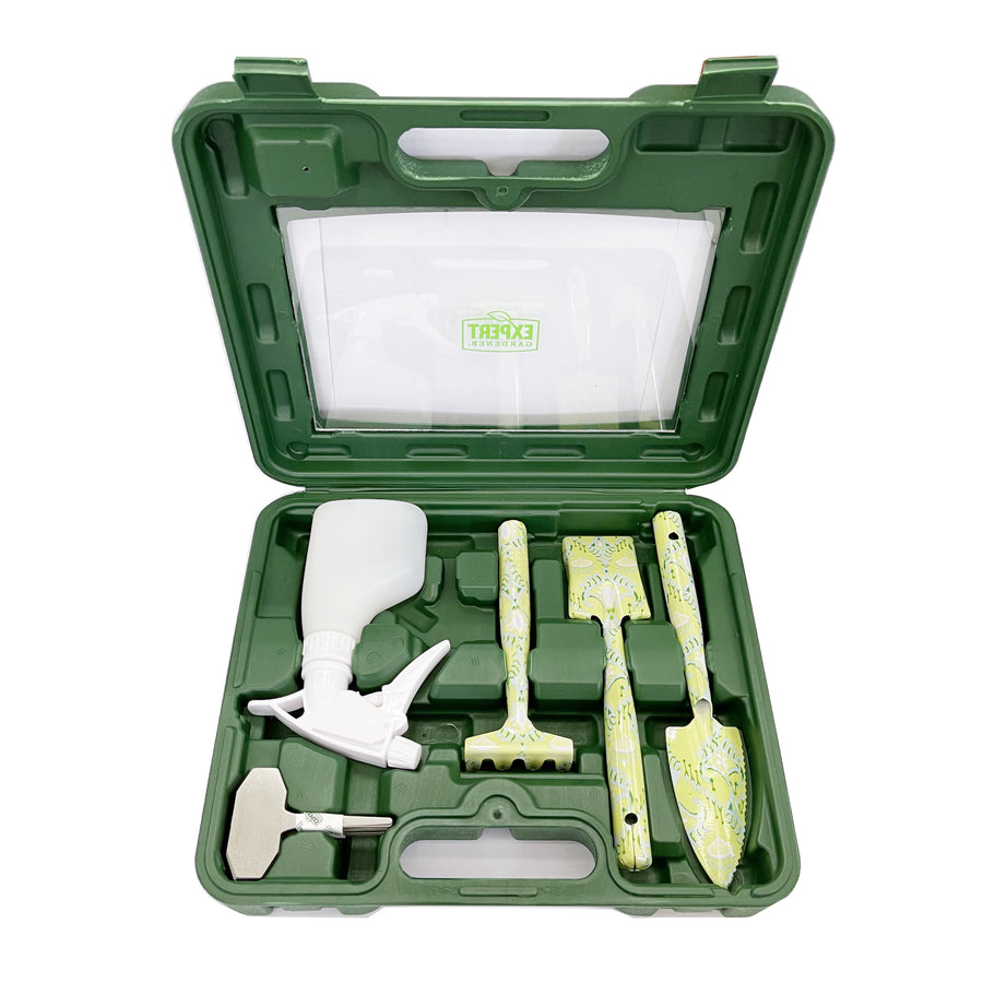 Open green plastic carrying case containing patterned trowel, rake, small shovel, spray bottle and metal plant marker