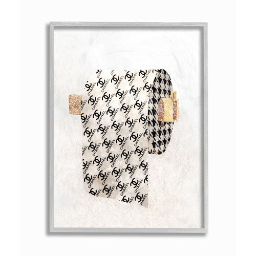 Framed stylized toilet-paper roll art print with repeating Chanel-like logo pattern and glitter accents on a light textured background.