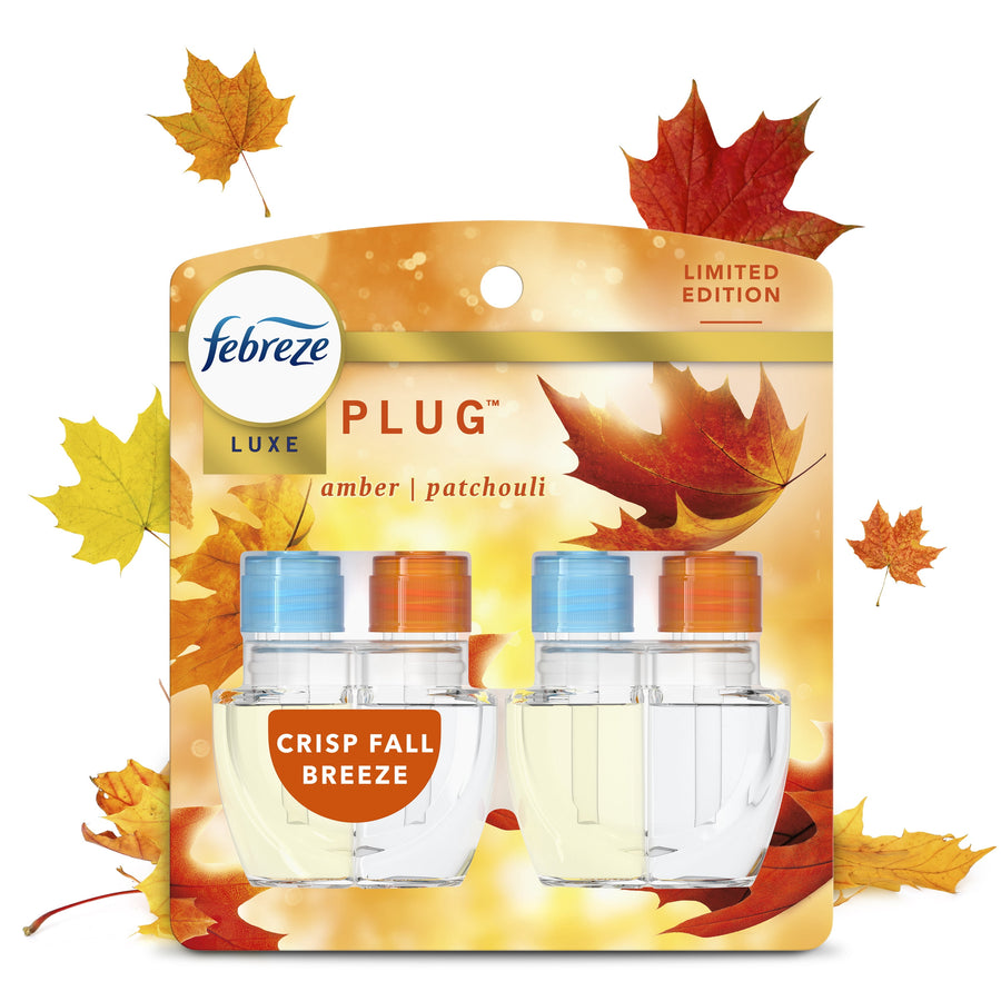 Febreze Luxe plug-in scented oil refill 2-pack blister card with autumn leaves and 'Crisp Fall Breeze' label
