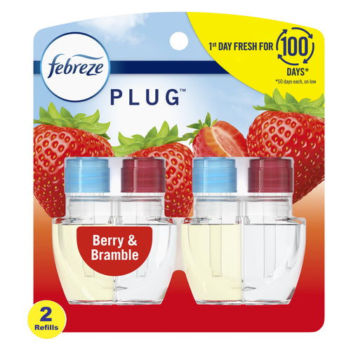 Retail blister pack of Febreze Plug scented oil refills in berry-themed packaging showing two clear refill bottles and strawberries