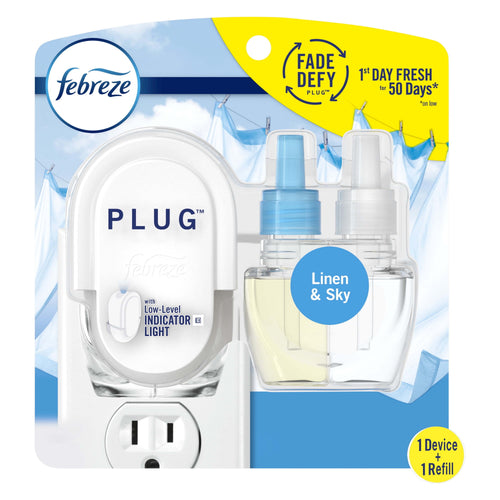 Febreze Plug-In warmer and two refill bottles in retail blister pack labeled Linen & Sky with sky background
