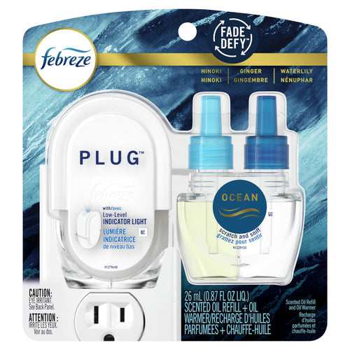 Febreze Plug scented oil starter kit in retail blister pack showing warmer and two Ocean refill bottles