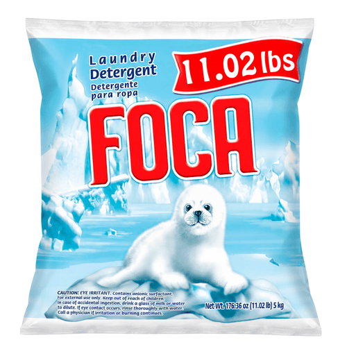 Front-facing bag of FOCA powder laundry detergent with seal pup artwork and prominent red FOCA logo on icy blue background.