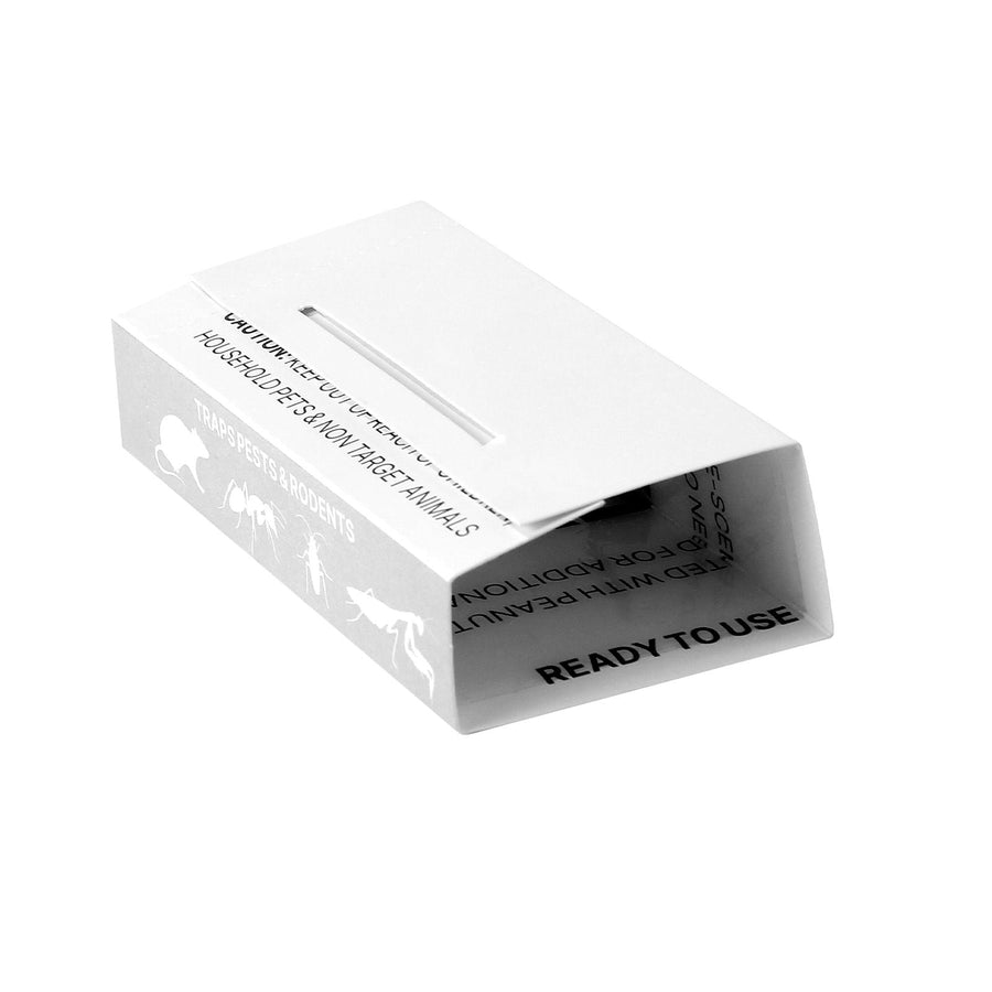Folded white cardboard insect glue trap with open end and 'READY TO USE' text visible