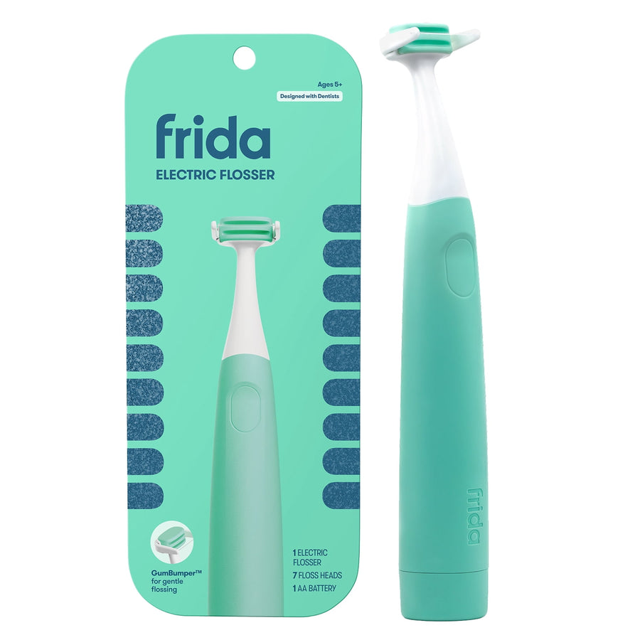 Mint teal Frida electric flosser standing beside its matching retail carded packaging on white background