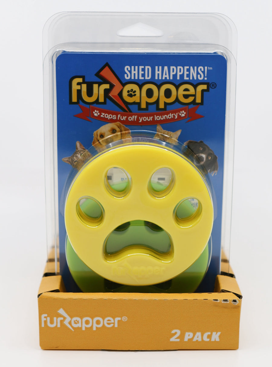 Blister pack showing yellow paw-shaped FurZapper silicone lint remover displayed on blue backing with 2 pack sleeve