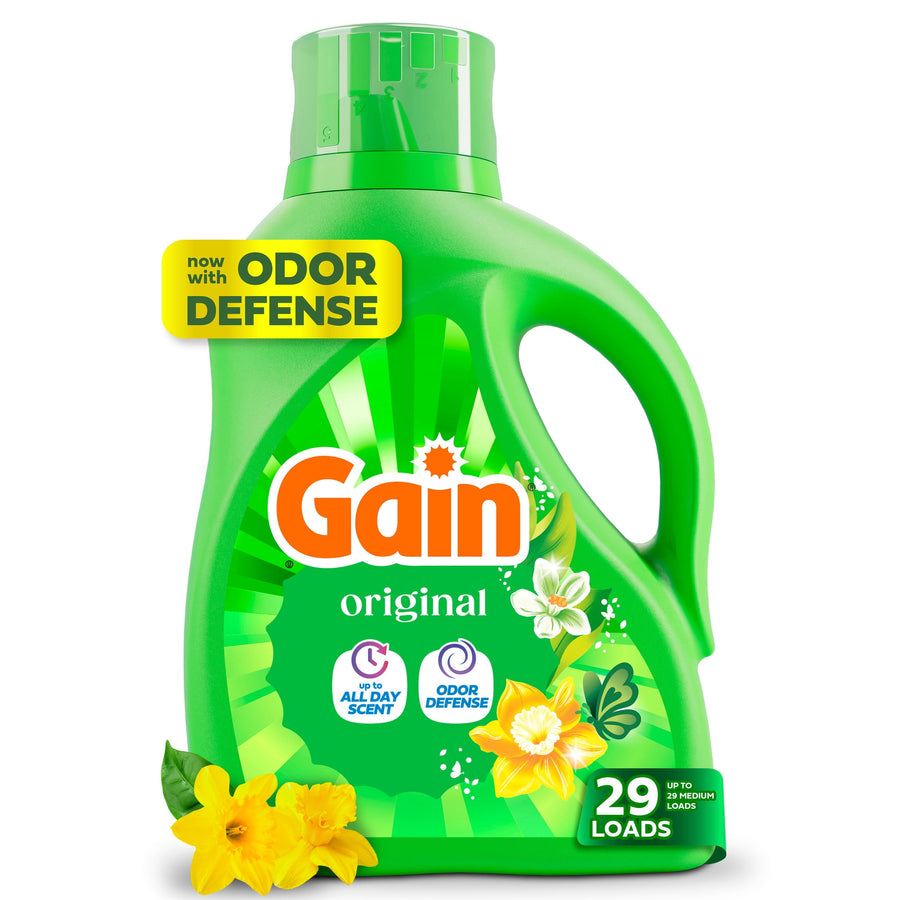 Green Gain Original liquid detergent bottle with floral artwork and 'odor defense' badge on a white background.